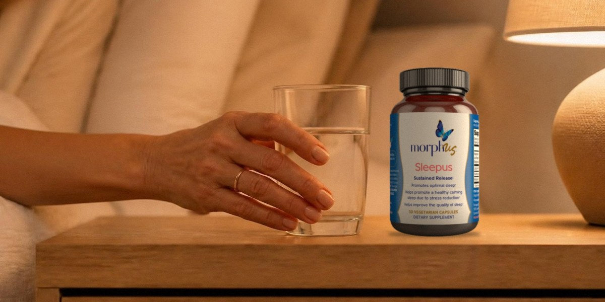 Sleepus bottle on a nightstand next to a glass of water